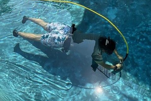 a technician is doing underwater repair